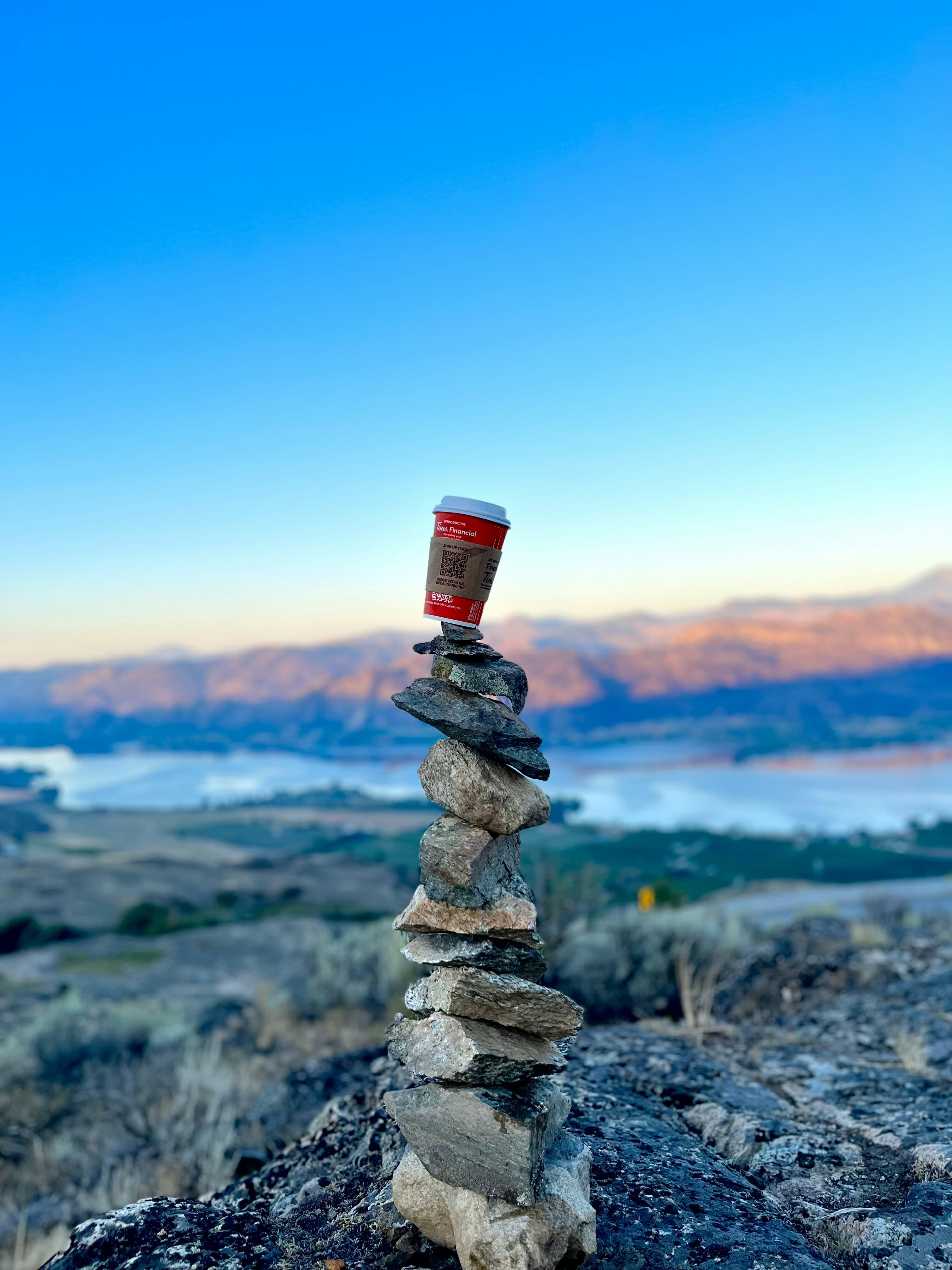 Coffee on the rocks with a viewpoint from a mountain on osoyoos