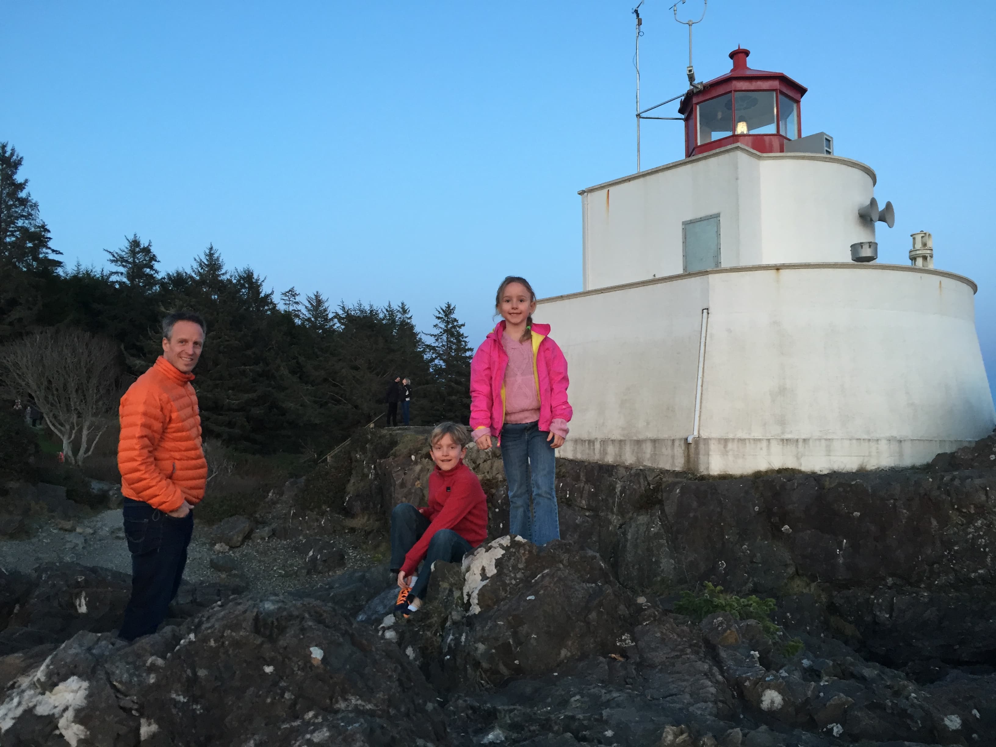 A man and his two kids at the Amphitrite Lighthouse